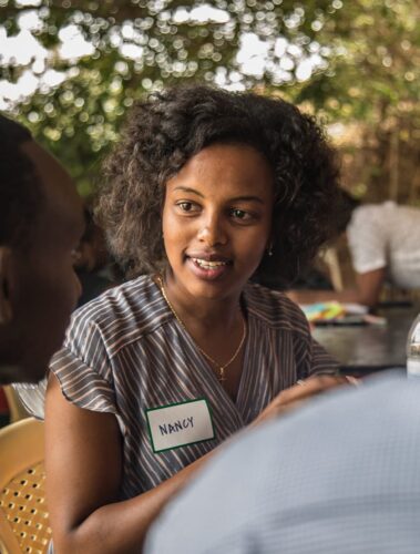 Woman talking to colleague